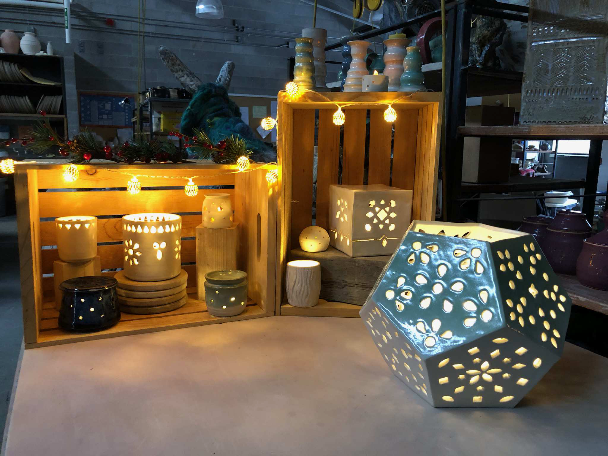 Stoneware pottery lanterns and candleholders.